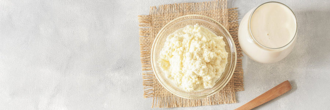 Bovine colostrum and dairy in a bowl and glass on table