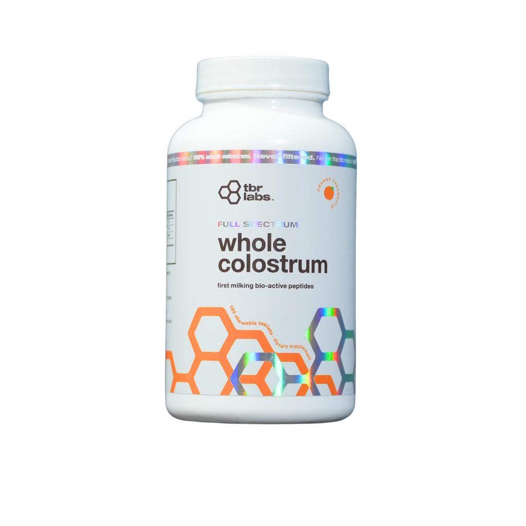 Bottle of TBR Labs Whole Colostrum - Orange Creamsicle on a white background